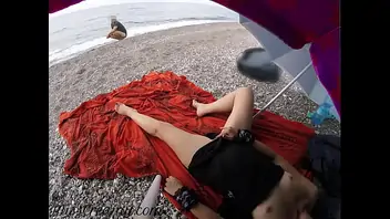 Flashing my pussy in front of a young guy in public beach and he helps me squirt it s very risky